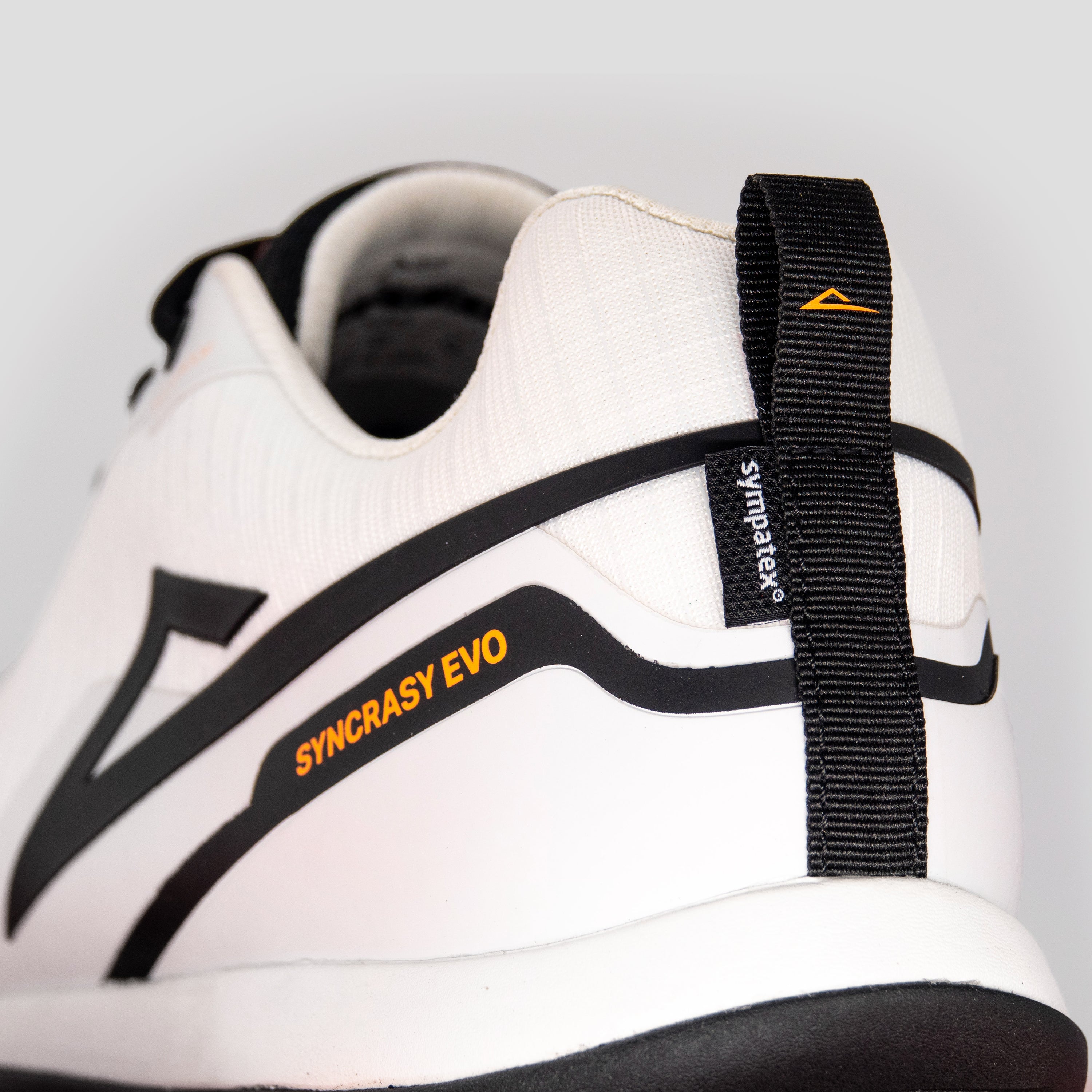 Detailed view of white/black disc golf shoe