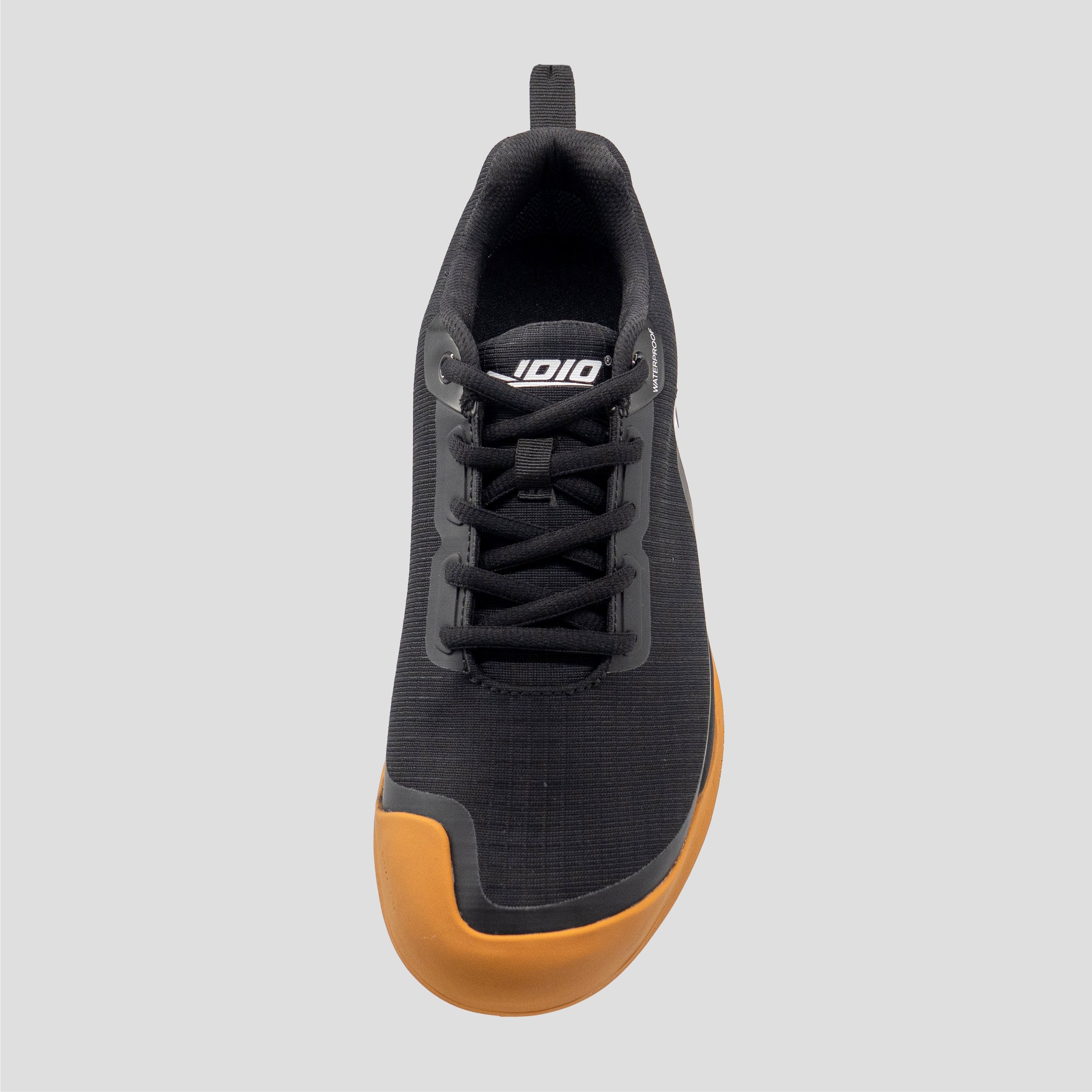 Top view of a Black/Gum disc golf shoe