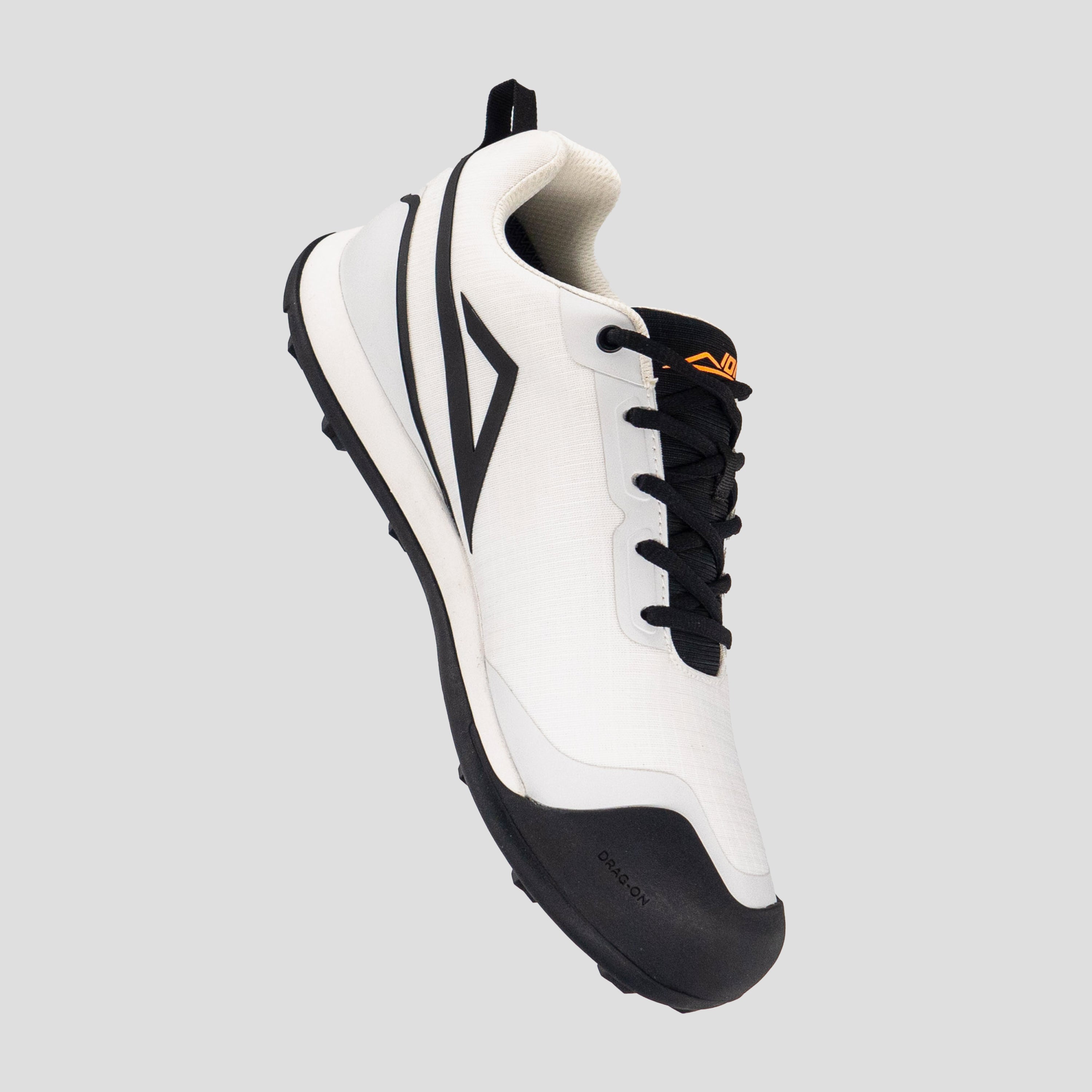 Medial view of white/black disc golf shoe